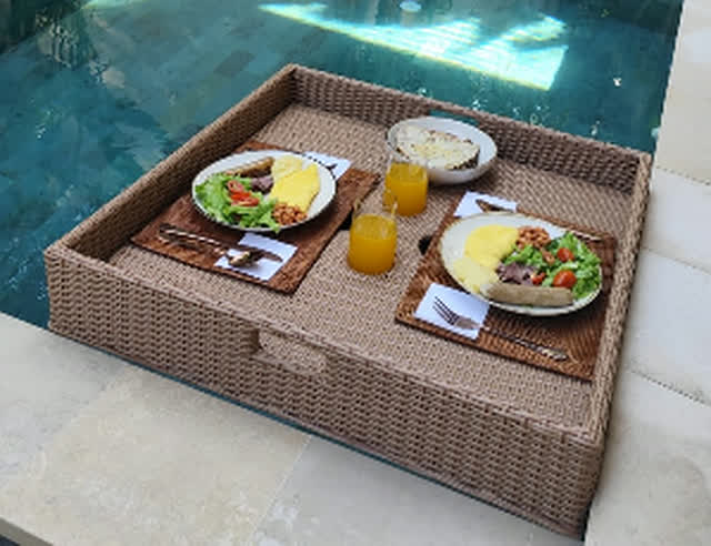 Floating breakfast tray on a private villa pool in Bali